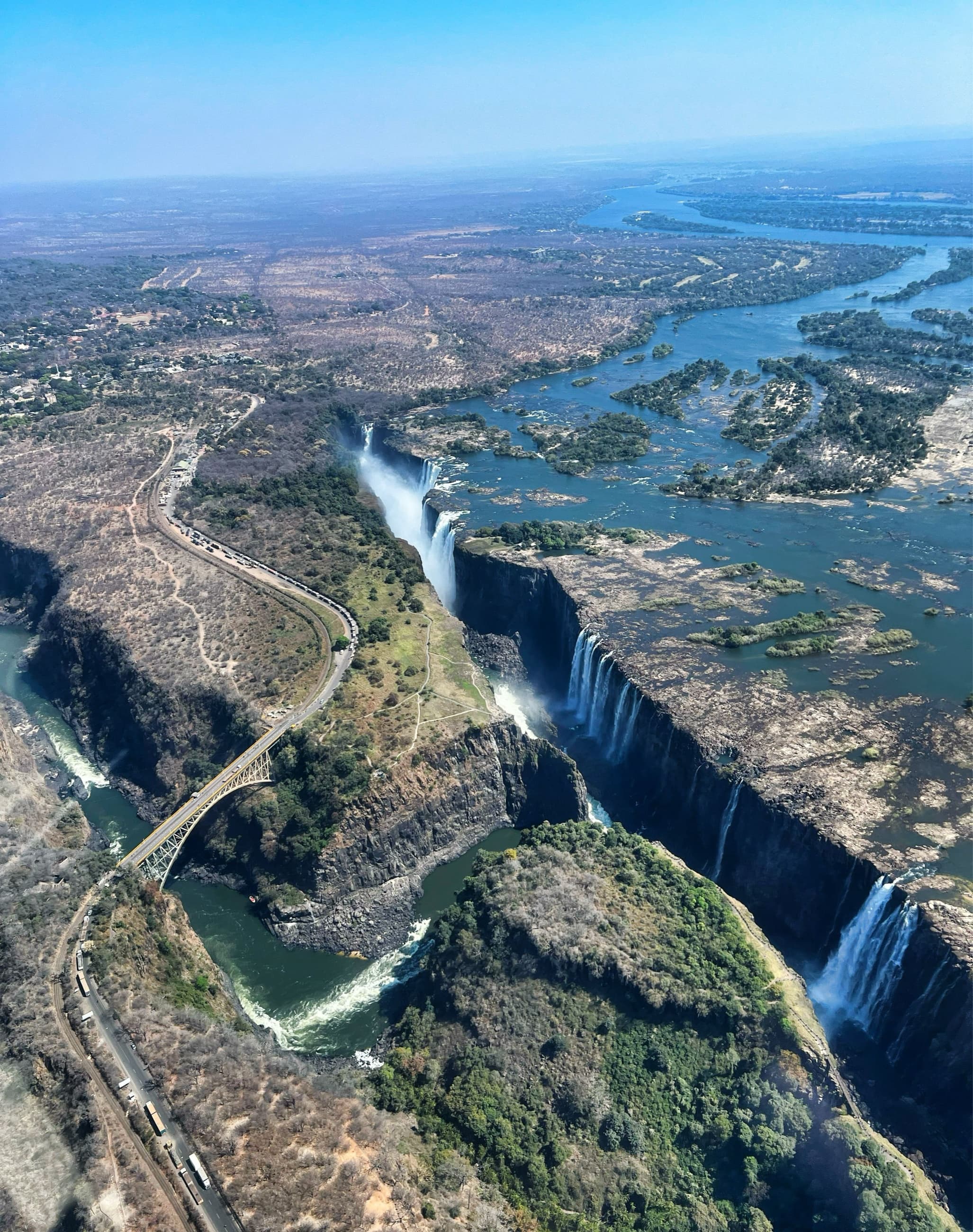 Aerial view of Victoria Falls, the gorge, and the Victoria Falls Bridge