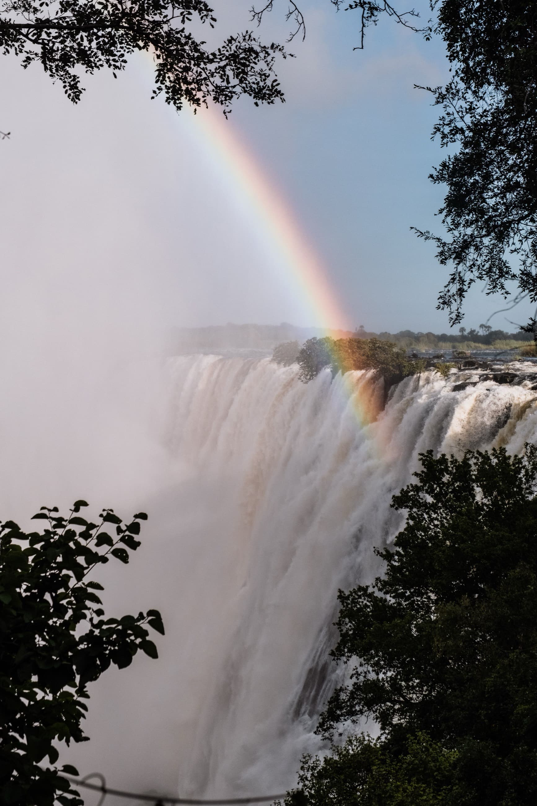 A rainbow arcing through the spray of Victoria Falls